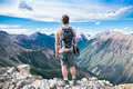 young man looks over mountain range