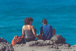 man and wife spending time together on the shore