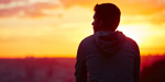 young man looking over horizon