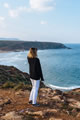 woman looks over the sea