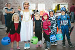 children dressed in Halloween Costumes